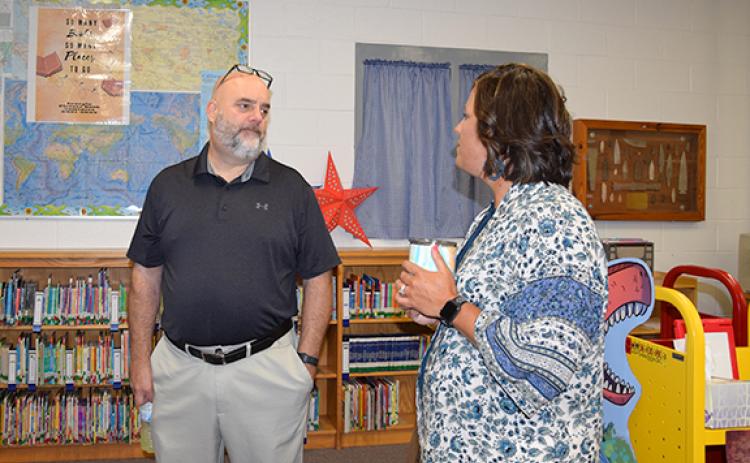 Acting Superintendent Chuck Colquitt talks with Lavonia Elementary Assistant Principal Jamie Hammock during a visit to the school Tuesday. (Photo by Sinclair)