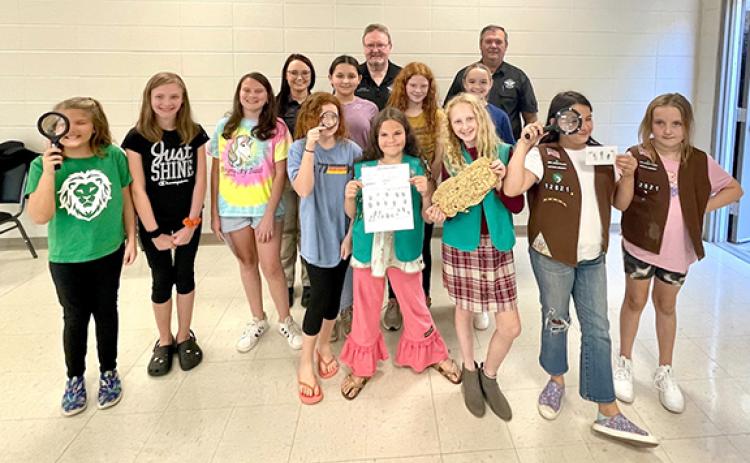 Girl Scout Troop 12821 members learning detective skills from Franklin County Sheriff’s Office investigators Desiree McAdams and David Cochran and Sheriff Stevie Thomas are (from left) Madalyn Chumley, McKenna Gibson, McKinley Goss, Brooke Graham, Serenity Hollis, Rachel Burger, Jenny Ruth Stephenson, Kenzie McDuffie, Brooke Tate, Wynter Barnes and Kinley Echols. 