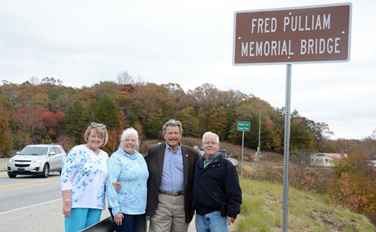 The children of Fred Pulliam – Bobbie Starcher, Robbie Ayers and Freddy Pulliam – pose with State Rep. Alan Powell, who ushered a resolution through the Georgia General Assembly to name the bridge after their father.  (Photo by Scoggins)