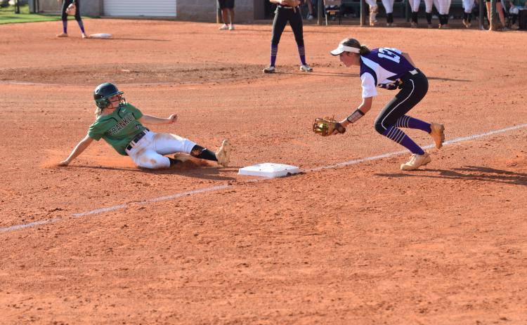 Lady Lion Josie Burton slides safely into third during the Region 8AAA opener against Monroe Area Thursday. (Photos by Scoggins)