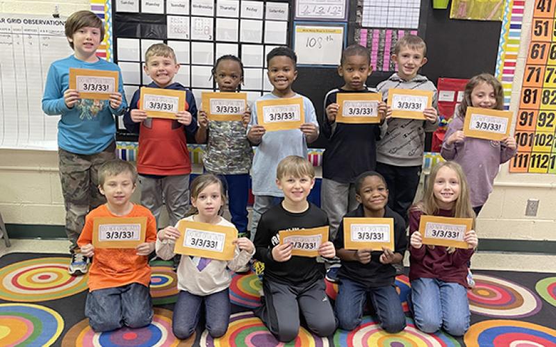 Students in Misty Moore’s first grade class at Royston Elementary show the time capsule envelopes they will open when they are seniors at Franklin County High School.